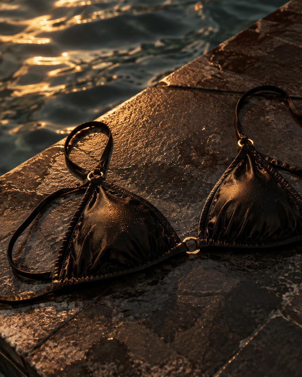 Placeholder editorial image of a black bikini top